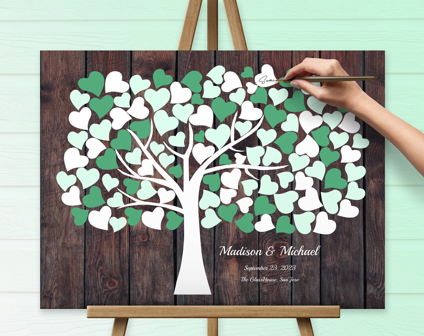Custom wedding gift canvas guest book in green and white color.